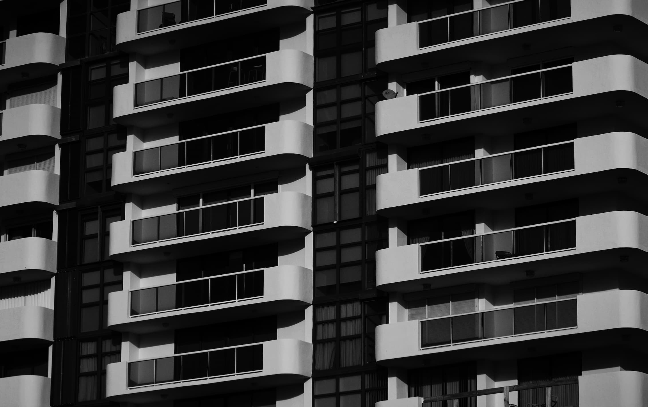 black and white close up of apartment building